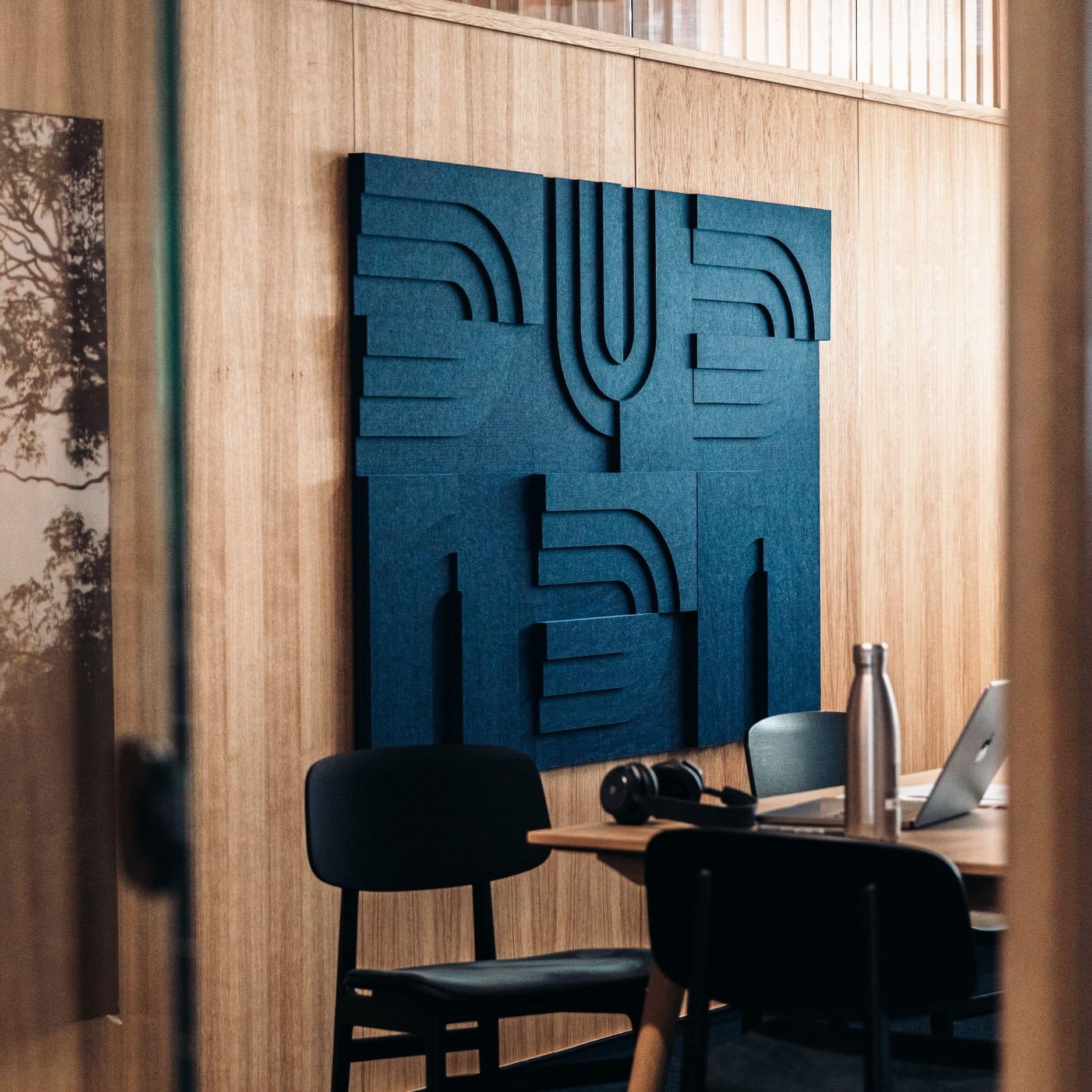 Modern workspace featuring Arturel blue Arch series acoustic panel