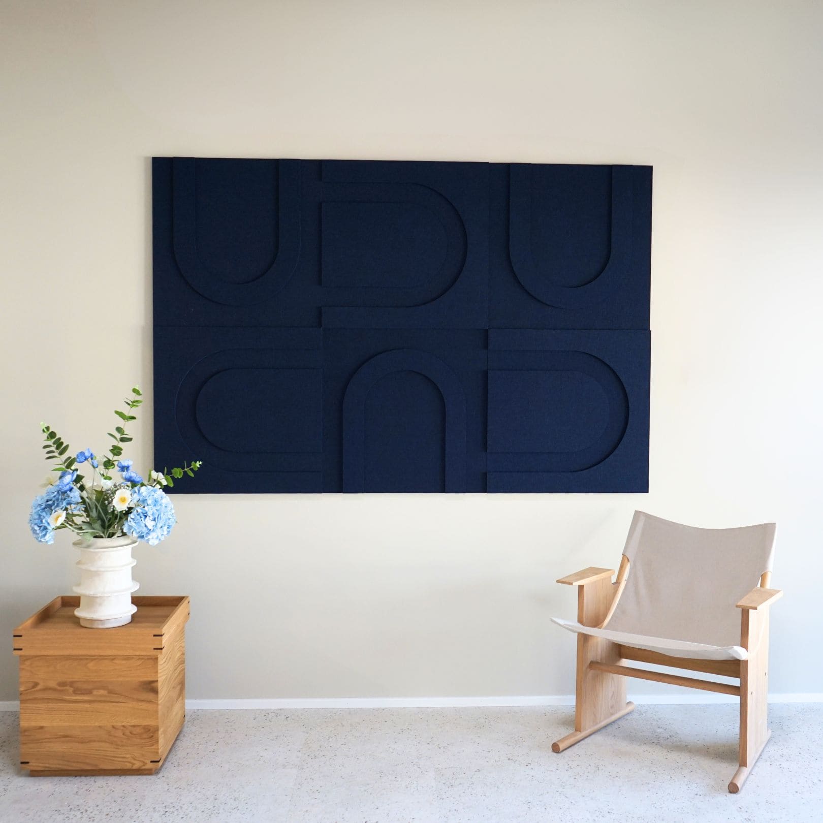 Sound-absorbing geometric art panels in dark blue from Arturel's collection, designed for acoustic enhancement and modern interiors.