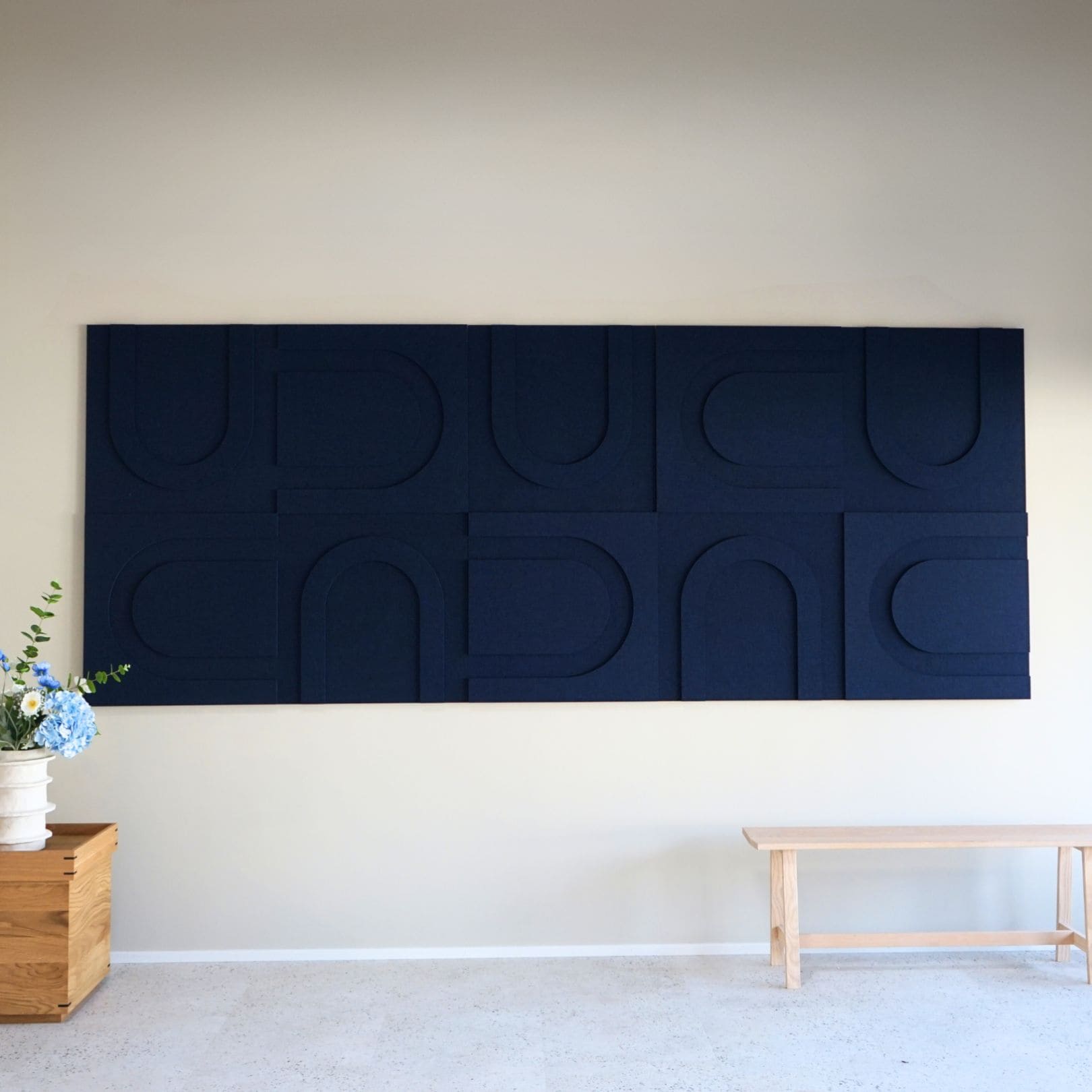 Large blue geometric sound-absorbing art panels from Arturel, enhancing acoustic quality and modern interior design.